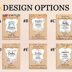 May include: A collection of baby shower invitation cards with a onesie design. Each card features the text "Baby in Bloom" and the name and date of the event. The cards are on a kraft paper background with floral accents.