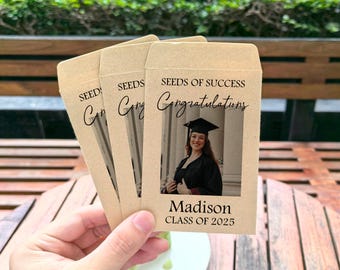 May include: Brown paper envelopes with the text "Seeds of Success Congratulations" and a photo of a graduate wearing a cap and gown. The text "Madison Class of 2025" is printed below the photo.