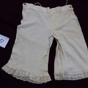 May include: White cotton underwear with lace trim. The underwear has two small holes in the front.