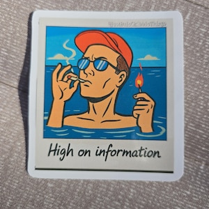 May include: A sticker featuring a retro illustration of a man in sunglasses and an orange cap, smoking a cigarette while in the water. The text "High on information" is below the image.