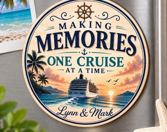 May include: A round wooden sign featuring a cruise ship on the ocean at sunset, with palm trees and a ship wheel graphic. The text reads: MAKING MEMORIES ONE CRUISE AT A TIME, and Lynn & Mark. The design includes a small anchor icon.