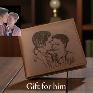 May include: A light brown leather wallet with a custom engraved image of a couple kissing. The wallet has a classic bi-fold design. The text "Gift for him" is at the bottom of the image.