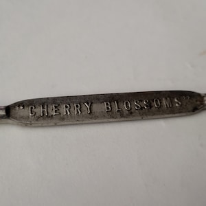 Vintage metal advertising bottle opener