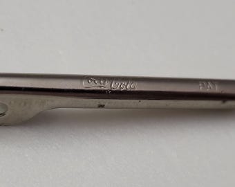 Pequeño abridor de botellas vintage de Coca-Cola