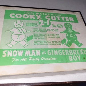 Metal cooky cutter snow man or gingerbread boy