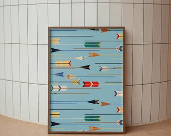May include: A rectangular wall art print in a brown wooden frame featuring a light blue background with a repeating pattern of horizontal arrows. The arrows are rendered in various colours including red, yellow, green, blue, black, and white.
