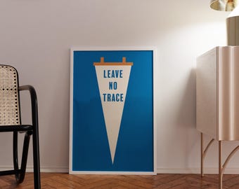 May include: A framed wall art print featuring a white triangular pennant centred on a solid blue background. The pennant has a tan top bar and displays the text LEAVE NO TRACE in bold blue capital letters, oriented vertically within the shape.