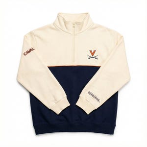 May include: Cream and navy blue quarter-zip sweatshirt. The top half is cream with the word "CAVAL" in brown on the left chest. The bottom half is navy blue. An orange stripe separates the two colors. The right chest has a logo with a "V" and crossed swords.