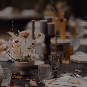 May include: A rustic wooden table setting with a floral arrangement in a ceramic vase. The flowers are a mix of dried grasses and blush pink roses. The table is set with a white tablecloth, a glass goblet, and a place setting with a napkin and silverware. The text "TESTIMONIALS" is visible on the left side of the image.