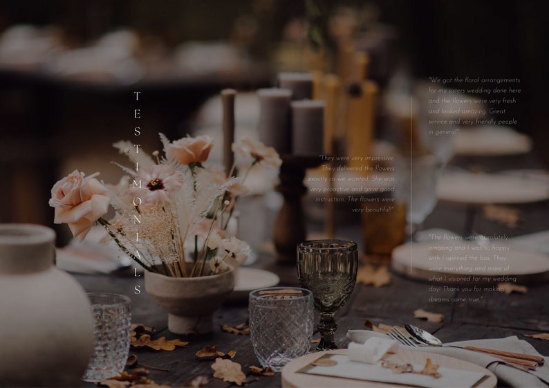 May include: A rustic wooden table setting with a floral arrangement in a ceramic vase. The flowers are a mix of dried grasses and blush pink roses. The table is set with a white tablecloth, a glass goblet, and a place setting with a napkin and silverware. The text "TESTIMONIALS" is visible on the left side of the image.