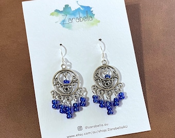 Boho chandelier dangle earrings! Pretty royal blue glass beads, with silver-plated stainless steel hooks. Approx 5.5cm