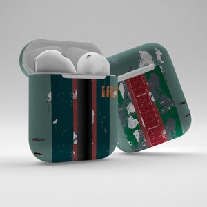 May include: A green, red and black patterned case for wireless earbuds. The case has a textured, distressed look.