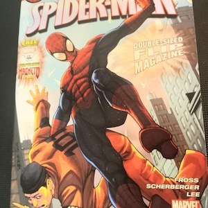 Puede incluir: Cómic de Marvel Adventures Spider-Man. La portada muestra a Spider-Man en una pose dinámica, luchando contra una figura con un mono naranja. El cómic está etiquetado como "Double-Sized Flip Magazine" e incluye el logo de Marvel.