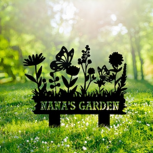 May include: Black metal garden stake with a silhouette of flowers, butterflies, and the text "NANA'S GARDEN".