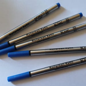 May include: Five blue and silver Mont Blanc rollerball refills.