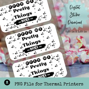 May include: Three printable stickers with a white background and black text that reads "OPEN ME Pretty Things << INSIDE >>". The stickers are decorated with small black hearts. The text "Digital Sticker Download 2.25 in X 1.25 in" is visible in the top right corner of the image.