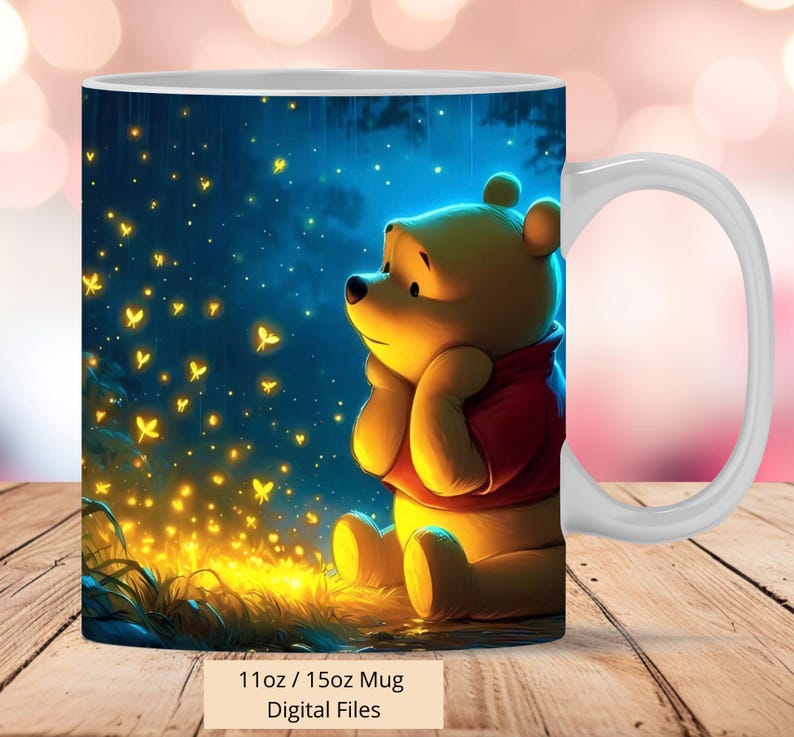 May include: A white ceramic mug with a Winnie the Pooh illustration. The mug features a blue night sky background with yellow fireflies and a depiction of Winnie the Pooh sitting and looking up at the fireflies. The mug has a handle and the text "11oz / 15oz Mug Digital Files" is printed below the image.