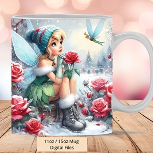 May include: A white ceramic mug with a winter scene featuring a fairy with blue wings and a green dress, holding a red rose. The fairy is wearing a blue and white hat and white boots. The background is a snowy forest with red roses and a blue butterfly.