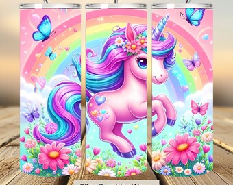 May include: A 20oz tumbler wrap featuring a whimsical unicorn design. The pink unicorn has a blue and purple mane and tail, adorned with flowers, set against a rainbow and butterflies. The tumbler has a straw.