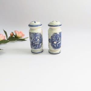 Vintage Delft-style salt and pepper shaker with countryside decor