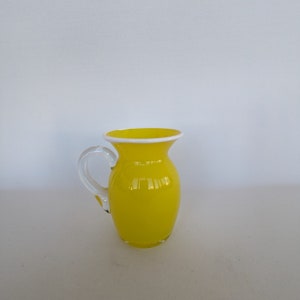 Hand-blown lemon Yellow Glass Pitcher with white rim and clear handle