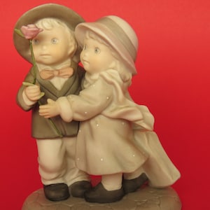 Enesco figurine “Blooming with love” by Kim Anderson