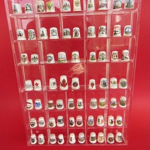 Plexiglass display case with 69 porcelain thimbles,city and monuments decoration