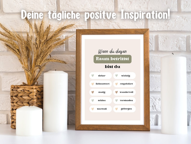May include: A framed print with a beige background and the text "Wenn du diesen Raum betrittst bist du" in black. The print features a list of positive affirmations in German, including "sicher", "wichtig", "liebenswert", "respektiert", "mutig", "wundervoll", "schlau", "verstanden", "wertvoll", and "geborgen".