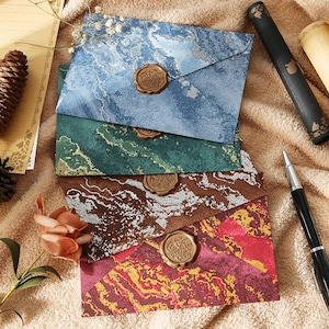 Sobre dorado, nuevo estilo de paisaje de playa del estrecho, postal de alta gama para carta de invitación de boda, membrete con patrón de tela sellada con cera