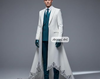May include: A formal white coat with a long train and intricate dark blue embroidery. The coat is worn over a teal suit with a matching tie and gloves. The image includes the text "Ansari Art".