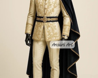 May include: Cream-colored formal suit with gold embroidery, a black belt, and a navy blue cape. The suit includes a jacket, pants, and a cape. The text "Ansari Art" is visible on the lower right. Black shoes complete the ensemble.
