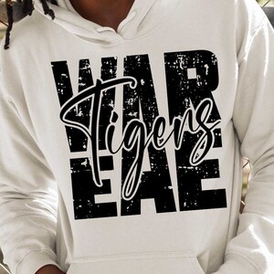 May include: White hoodie with a black distressed graphic that says "WAR Tigers EAE".