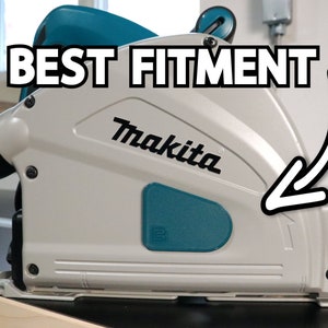 May include: A close-up of a gray and teal Makita circular saw with a black dust port. The saw is on a wooden surface and the text "BEST FITMENT" is written in white letters on a black background above the saw.