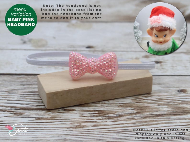 May include: A baby pink headband with a sparkly bow, displayed on a wooden block. The headband is white and the bow is covered in small, shiny embellishments. A green circle with the text "BABY PINK HEADBAND" is in the upper left corner.