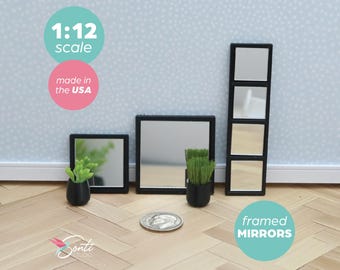 May include: Miniature framed mirrors in black frames, with small potted plants. The mirrors are 1:12 scale and made in the USA. The image includes a dime for size reference. The mirrors are square and rectangular.