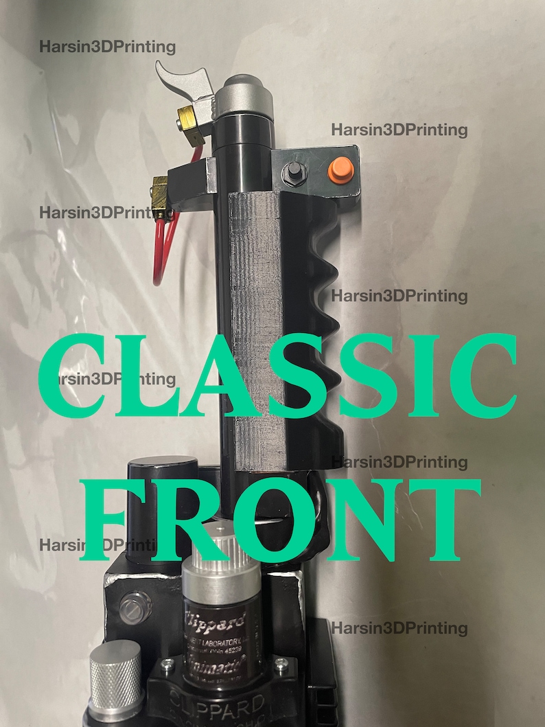 May include: A black and silver 3D printed prop with a green and silver valve, a red lever, and a black handle. The prop is labeled "CLASSIC FRONT" in green text. The prop is labeled "Harisin3DPrinting" in white text.