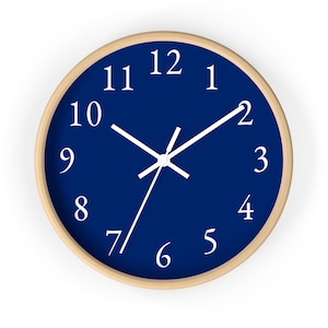May include: A round, wooden-framed clock with white numbers and hands on a dark blue background. The clock face shows the time as 1:55.