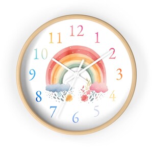 May include: A white clock with a rainbow, clouds, and flowers on the face. The numbers 1 through 12 are displayed in a rainbow color scheme.