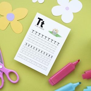May include: A printable worksheet for practicing writing the letter 'T'. The worksheet features a cartoon Togepi, a Pokemon character, and the text 'Tt for Togepi!'