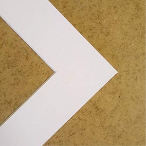 May include: White mount board with a bevelled edge, ideal for framing artwork or photographs.