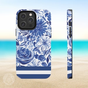May include: A white and blue floral phone case with a blue and white striped border. The case is designed for a phone with a camera bump.