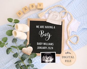 May include: A black letter board with the text "We are having a Boy" and "Baby Williams January 2024".  A white onesie, a white hat, and a pair of white booties are arranged around the letter board.  A small wooden sign with the text "DIGITAL FILE" is in the lower right corner of the image.