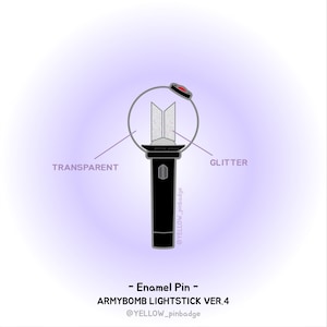 May include: Enamel pin depicting the ARMYBOMB LIGHTSTICK VER.4. The pin has a black handle, a transparent centre with glitter, and a red accent at the top. The design includes the text "TRANSPARENT" and "GLITTER".