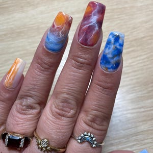 Blue and orange multi stones press on nails. Medium square in pic..