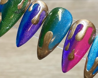 Multi color cat eye press on nails with gold drips. Stiletto medium in pic.