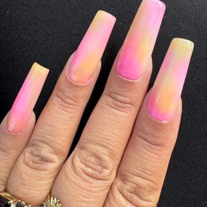Pink, yellow and orange press on nails. (Pink lemonade) coffin long in pic.