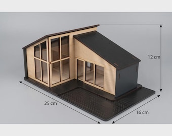 May include: A miniature modern house model with a black roof and light wood siding, featuring large glass windows and a black base. The model measures 25 cm in length, 16 cm in width, and 12 cm in height as indicated by the dimension lines.