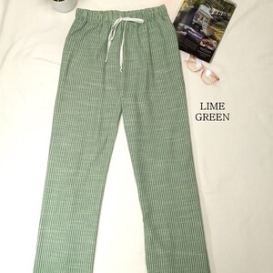 May include: Lime green striped pants with a drawstring waist.