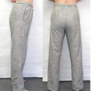 May include: A pair of black and white striped pants with a drawstring waist.