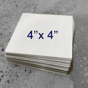 May include: A stack of 4" x 4" white blank square cards.